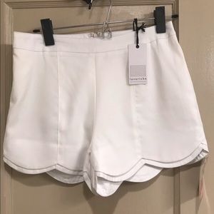 Scallop bottom white shorts